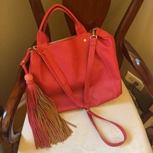 Stunning red leather Neiman Marcus crossbody tote bag w/ large tassel, zippers